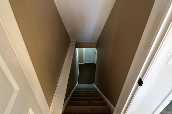 Carpeted stairs with tiled landing - 100 Southview Court Woodstock