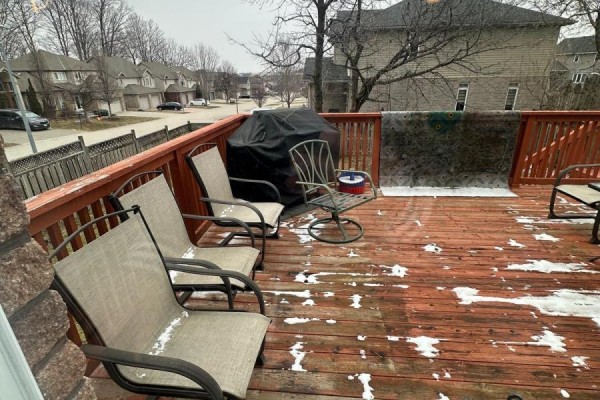Deck with chairs and grill, some snow - 100 Southview Court Woodstock