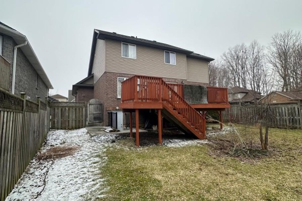 Backyard with wooden deck and fence - 100 Southview Court Woodstock