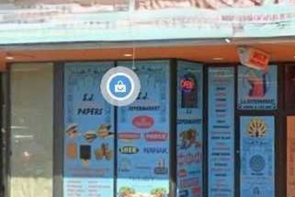 Close-up of storefront windows displaying various restaurant menus and open signs - 10004 100 Avenue, Grande Prairie