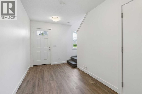 Laundry room - 1001, 24 Rivercrest Drive, Cochrane, AB T4C2V2 Photo 4