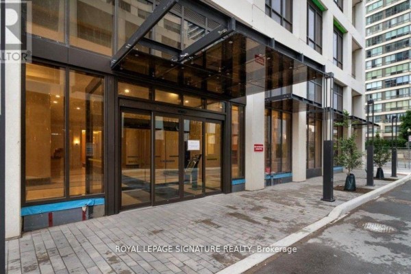Lobby with large windows, stained glass panels, and marble wall. - 1001 - 36 Elm Drive W, Mississauga