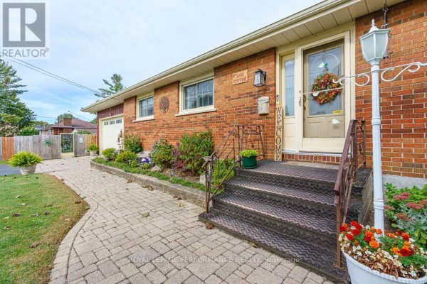 Close-up of the front entrance steps, brick exterior, and walkway. - 1001 Edythe Avenue, Cornwall