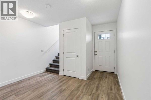 Living room - 1002, 24 Rivercrest Drive, Cochrane, AB T4C2C8 Photo 3