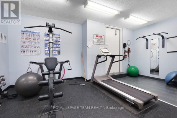 Home gym with treadmill, weight machine, exercise ball, and dumbbells - 1004 - 40 Arthur Street E Ottawa