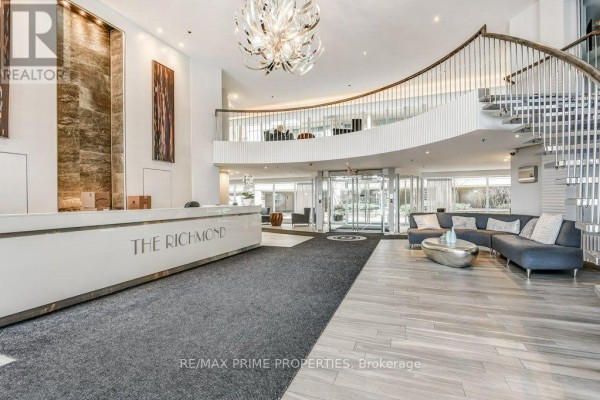 View from the upper level of the lobby, overlooking the entrance and reception. - 1009 - 323 Richmond Street, Toronto