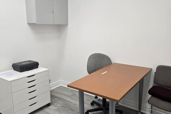 Hallway with carpeted floor, leading to a waiting area and office - 100a - 253 Danforth Avenue, Toronto