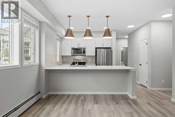 Living room - 101, 140 Mahogany Street Se, Calgary, AB T3M4E1 Photo 5