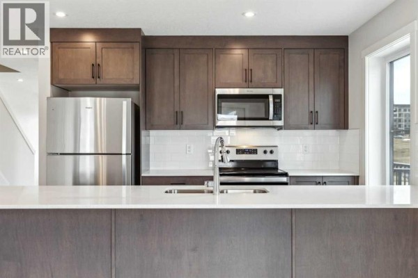 Kitchen - 101, 63 Belmont Passage Sw, Calgary, AB T2X4H7 Photo 5