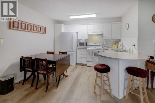 Dining room - 101, 6800 Hunterview Drive Nw, Calgary, AB T2K6K5 Photo 5