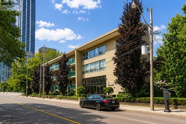 Exterior of 4 Rosedale Ravine apartment building with a black car parked in front. - 101 - 4 Sherbourne Street N, Toronto