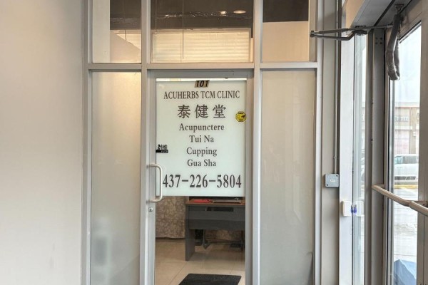 Massage table in a small treatment room with towels - 101 - 7130 Warden Avenue, Markham