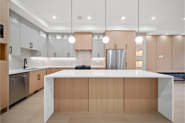 Front exterior view of a modern white duplex with grey accents and two attached garages. - 101 11480 138a Street, Surrey
