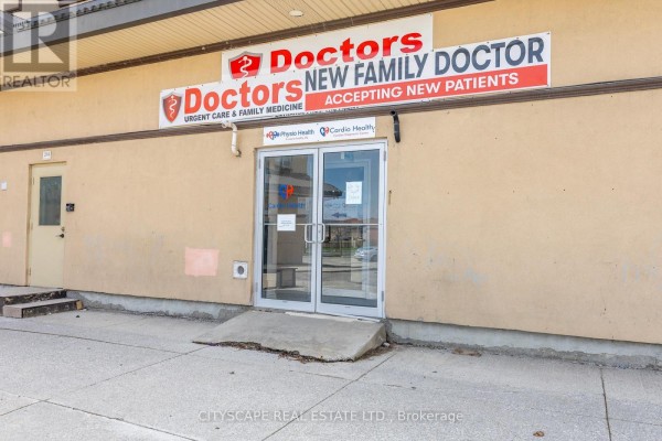 Double glass doors with signage for a medical clinic and physiotherapy center. - 101-bsmt - 2860 Denison Street, Markham