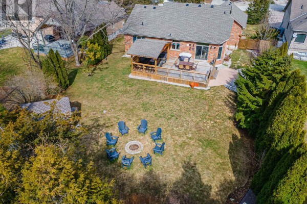 Backyard with fire pit, deck, patio, and shed - 10159 Meadowlilly Crescent Lambton Shores