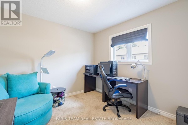 Office with desk, computer, printer, ergonomic chair, armchair, and floor lamp - 1016 Wright Drive Midland