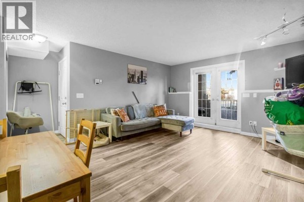 Living room - 102, 139 26 Avenue Nw, Calgary, AB T2M2C8 Photo 5