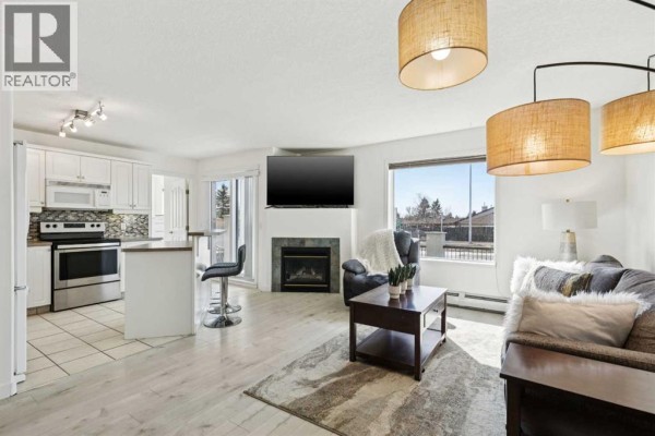 Living room - 102, 6102 Valleyview Park Se, Calgary, AB T2B3R6 Photo 3