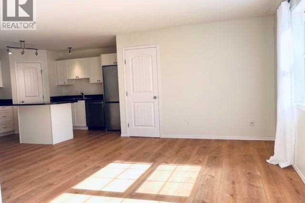 Living room - 102, 80 Panatella Landing Nw, Calgary, AB T3K0K8 Photo 4