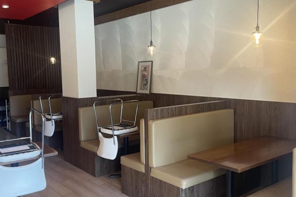 Dining area with booths, tables, and chairs in a restaurant setting. - 102 - 5460 Yonge Street, Toronto