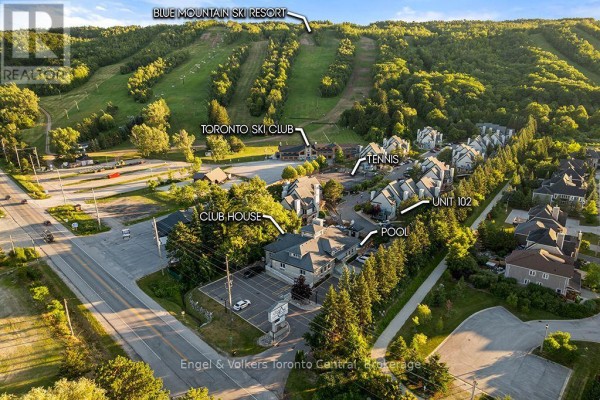 Aerial view showing Unit 102 near the Blue Mountain Ski Resort, tennis courts, club house, and pool. - 102 - 796468 Grey Road 19 Road, Blue Mountains