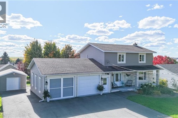 Aerial view of the residential property at 102 Plaisante Street, Drummond, showing the house and detached garage. - 102 Plaisante Street, Drummond