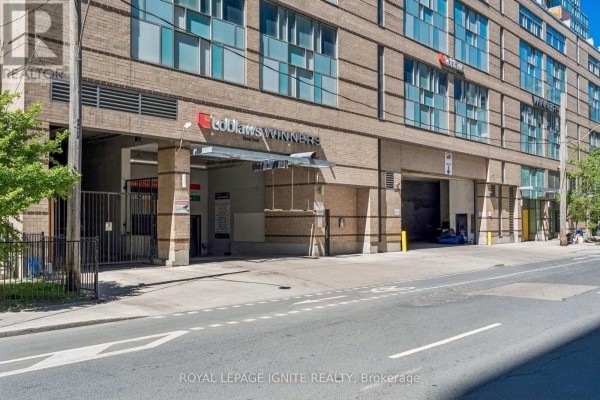 Street-level view of a parking garage entrance for Loblaw's and Winners stores. - 1021 - 543 Richmond Street W, Toronto