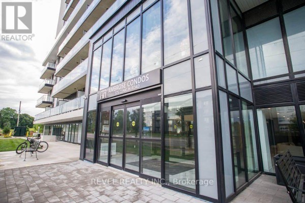 Glass entrance doors and windows of the Ambrose Condos building. - 1024 - 575 Conklin Road, Brantford