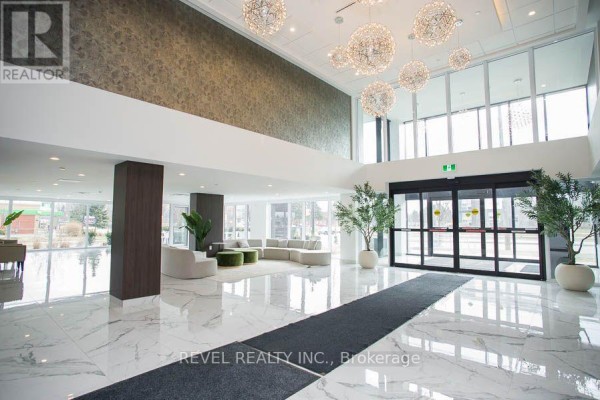 Spacious lobby with marble floors, modern furniture, and decorative light fixtures. - 1024 - 575 Conklin Road, Brantford
