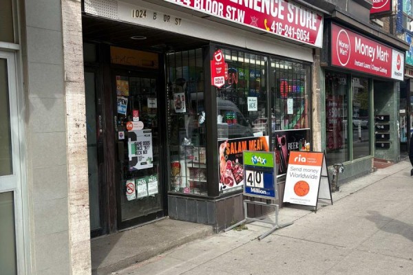 View of the store entrance and street-level facade of the convenience store. - 1024 Bloor Street W, Toronto