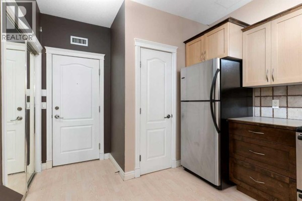 Living room - 103, 1606 4 Street Nw, Calgary, AB T2M2Y9 Photo 3