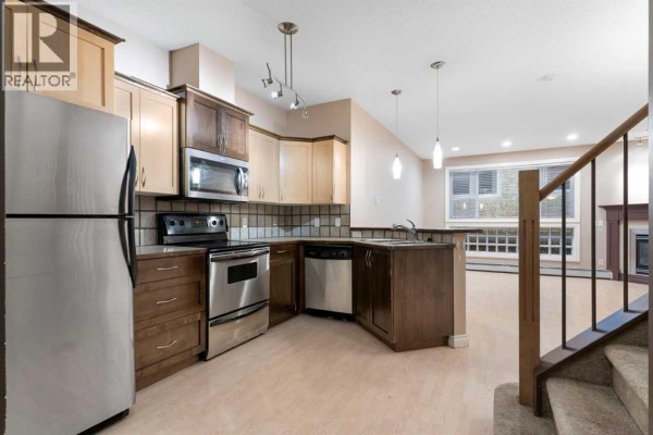 Primary Bedroom - 103, 1606 4 Street Nw, Calgary, AB T2M2Y9 Photo 4