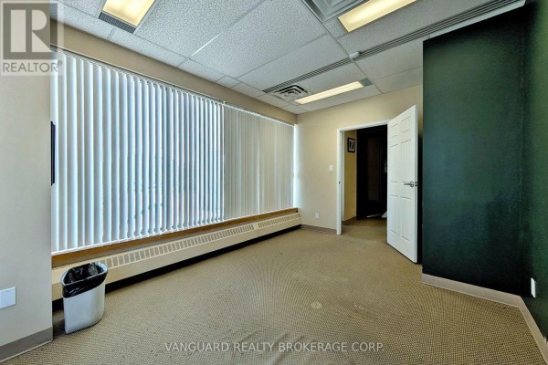 Another angle of The Southcom Building highlighting the parking lot. - 103 - 2227 South Mill Way, Mississauga