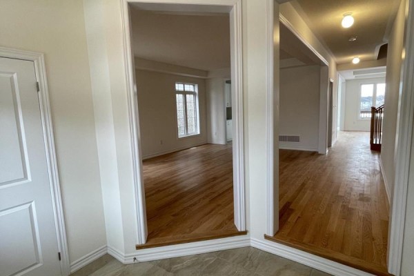 Interior view of hardwood floors and doorways to living areas and hallway. - 103 Nottingham Road, Barrie