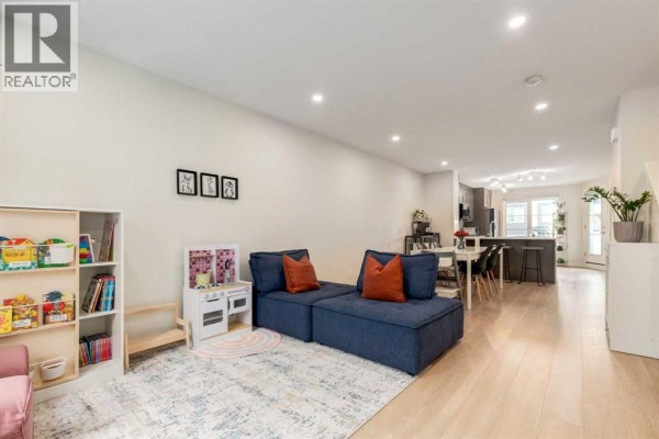 Living room - 104, 474 Seton Circle Se, Calgary, AB T3M3P6 Photo 5