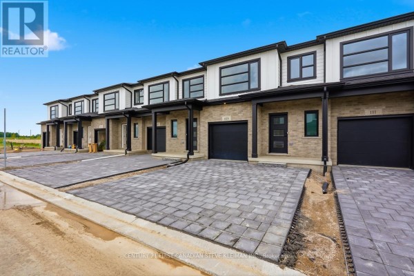 Front view of a row of townhouses with attached garages and paved driveways. - 104 - 2840 Buroak Drive, London North