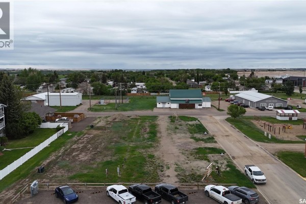 Ground-level view of lot 104-106 Thomson, featuring snow, grass, and neighboring structures. - 104-106 Thomson Street, Outlook