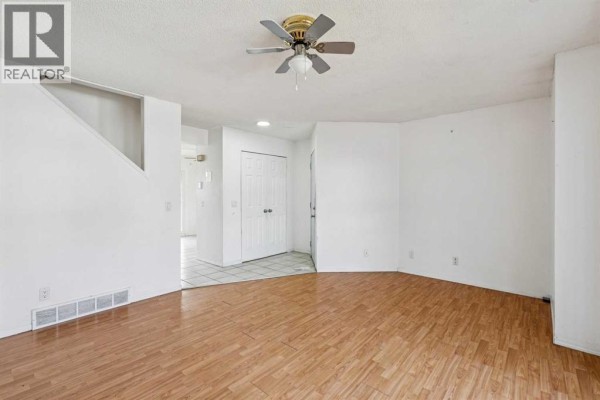 Living room - 104 Falmere Way Ne, Calgary, AB T3J2Y5 Photo 4