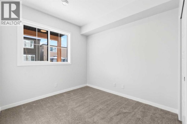 Bedroom - 105, 28 Red Embers Plaza Ne, Calgary, AB T3N2W1 Photo 2