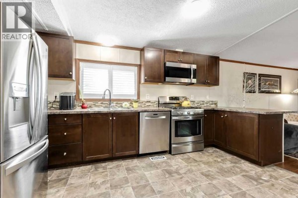 Laundry room - 105, 6724 17 Avenue Se, Calgary, AB T2A0W5 Photo 5