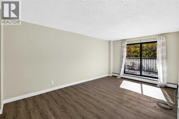 Bedroom - 105, 835 19 Avenue Sw, Calgary, AB T2T0H6 Photo 2