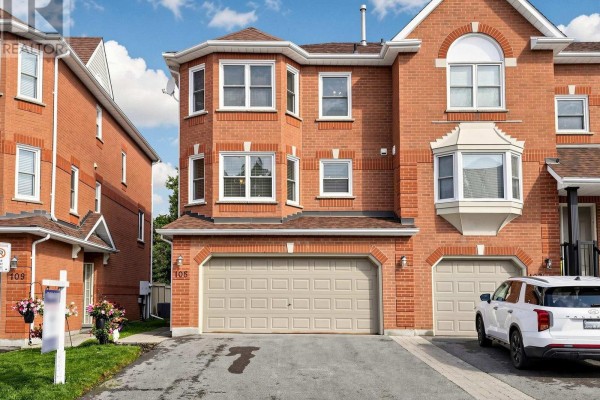 Front exterior of brick townhouses with garages, bay windows, and stairs. - 105 - 105 Leah Crescent, Vaughan