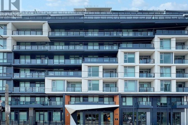 Front facade of a multi-story condominium building with a central entrance and varying window designs. - 105 - 556 Marlee Avenue, Toronto