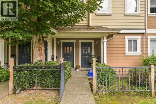 Apartment entrances labeled 105 and 107 with blue doors and small fences. - 105 2695 Deville Rd, Langford