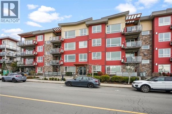 Entrance with stairs, railing, and a covered awning leading to the main door. - 105 300 Belmont Rd, Colwood