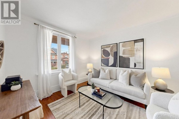 Hallway with white walls, tile flooring, and a door leading outside. - 105 Barker Avenue, Toronto