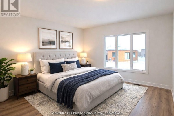 Cozy bedroom with a queen bed, large window, and neutral decor - 105 Creighton(lot 63) Drive, Loyalist