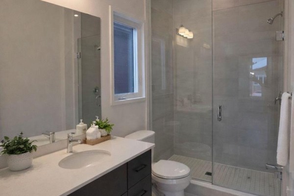 Bathroom featuring glass shower, modern vanity, and natural light - 105 Creighton(lot 63) Drive, Loyalist