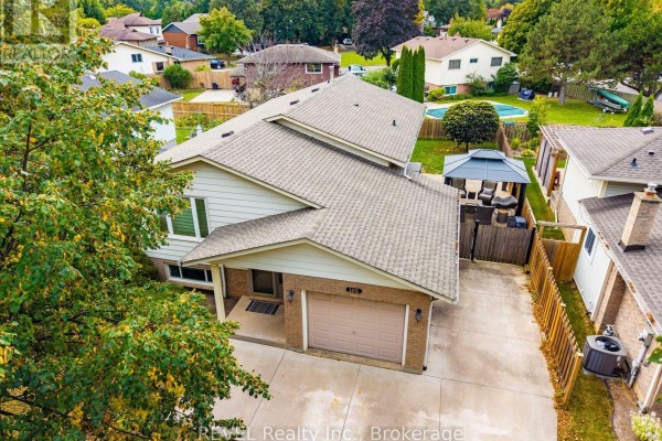 Aerial view of the bungalow at 105 Elma Street with a fenced backyard and gazebo. - 105 Elma Street, St  Catharines