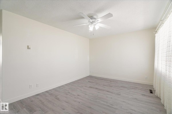 Primary Bedroom - 10531 128 Av Nw, Edmonton, AB T5E0J2 Photo 4